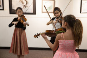 Violin students at a Barrett Suzuki recital